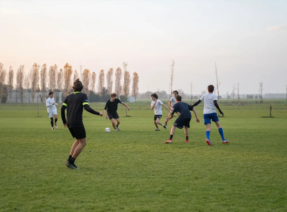 H-FARM students playing football in the open field