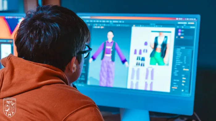 Studente progetta capi d'abbigliamento in 3D su un avatar digitale